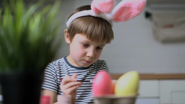Cute Little Boy Colouring Eggs for Easter