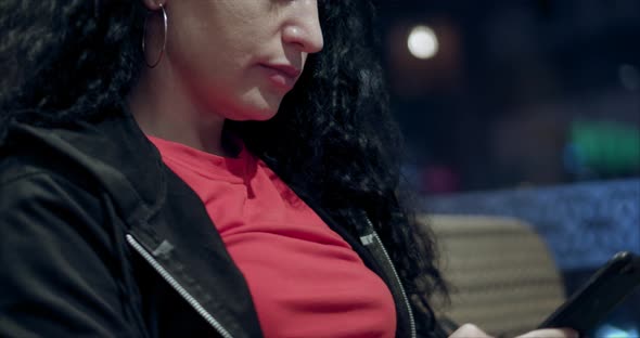 Relaxed Young Woman Using Smart Phone Surfing Social Media Checking News Playing Mobile Games or alt