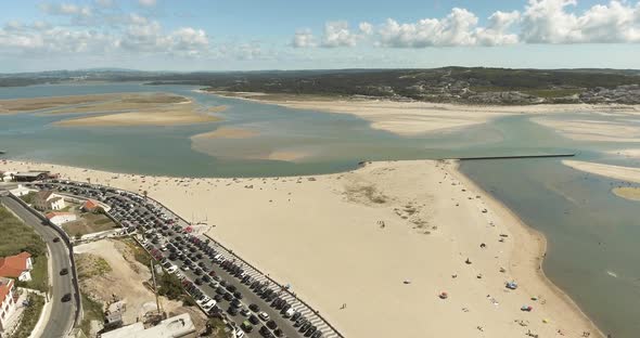 Beautiful White Sand Beach Lagoon Of Foz Do Arelho In Portugal - Aerial Drone Shot (Forward) alt