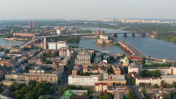 Top view of Podol. Many buildings and churches. Evening view of the river Dnipro. alt