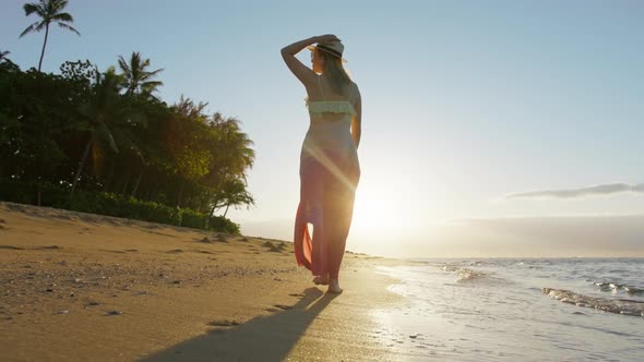 Woman in Beautiful Waving Dress on Summer Vacation on Tropical Hawaii Island USA alt