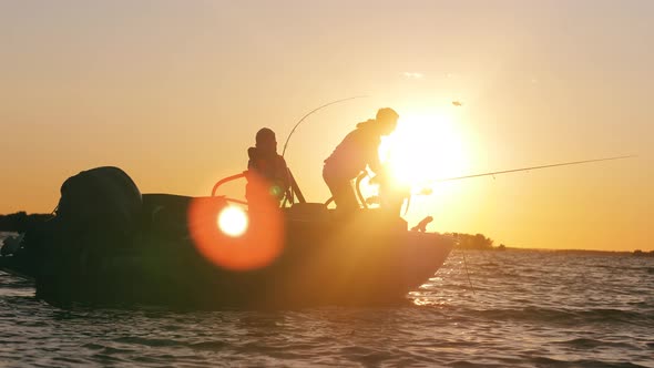 Dad Is Helping His Children To Fish From a Boat alt