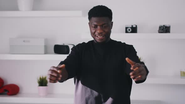 Guy Smiling and Warming Up for a Workout alt