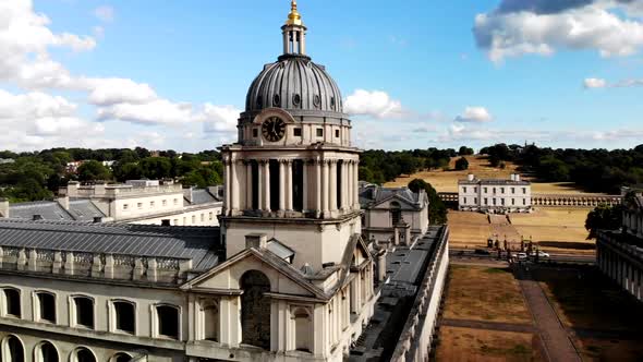 Drone footage of Old Royal Naval College in Greenwich, London City. Drone flies up and pans to the l alt