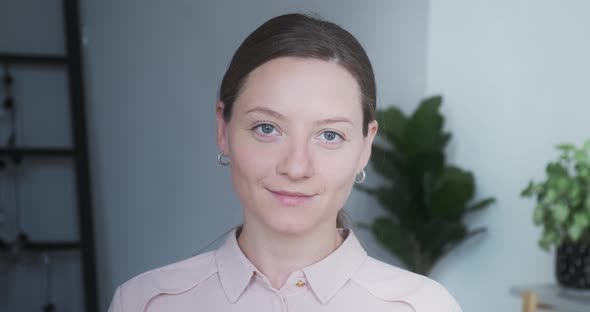 Closeup Portrait of Beautiful Young Brunette Woman Natural Beauty Blue Eyes Smiling Posing at Home alt