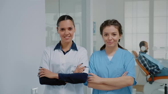Dentist and Nurse in Medical Uniform Standing at Dental Clinic alt