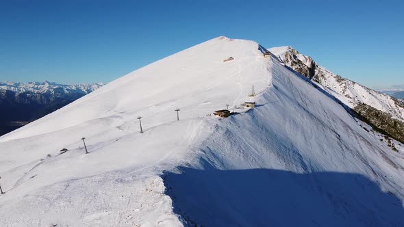 Flying over the snowy Mountains in the Winter alt