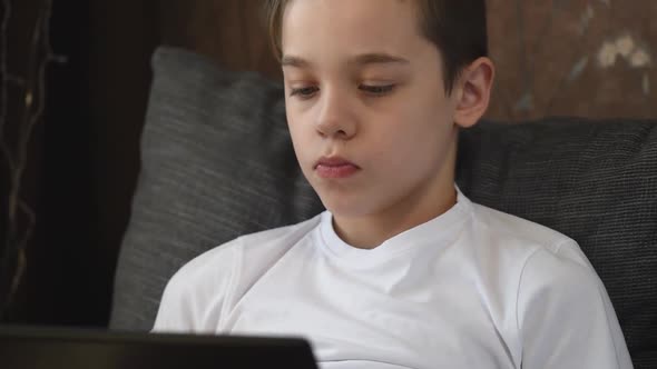 Young Boy at Home with Laptop