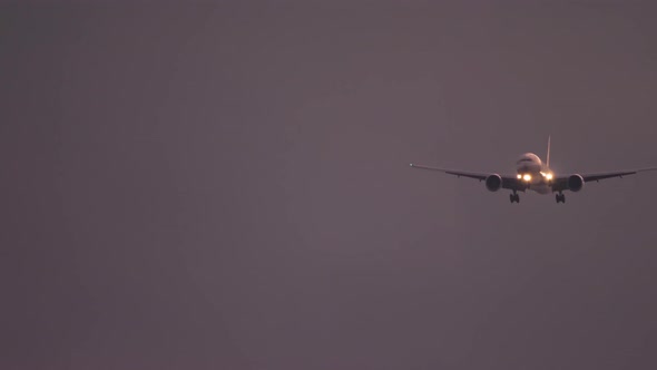 Airplane Approaching Over Ocean at Sunset Backgfround alt