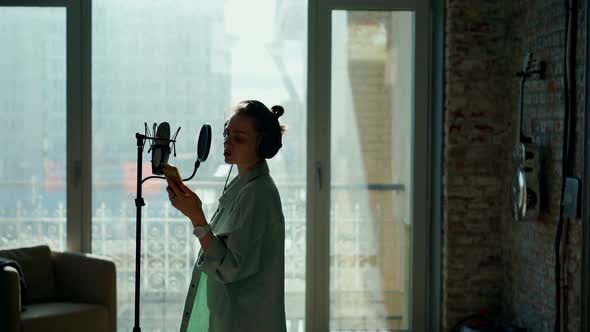 The Announcer Records the Advertising Text at the Recording Studio alt