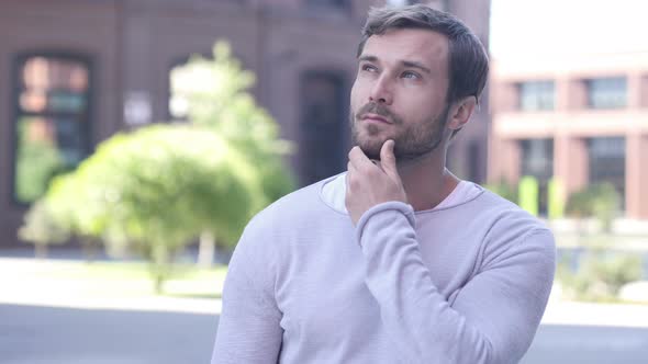 Thinking Handsome Man Outside Office alt