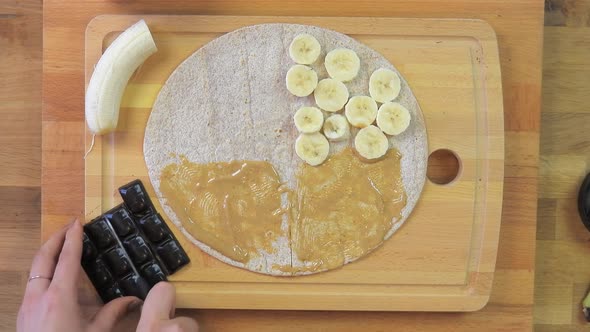 Preparing a Peanut Butter, Chocolate and Banana Toast Sandwich