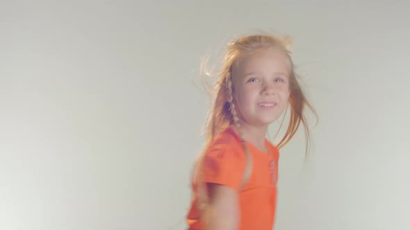 Girl spreading arms like an airplane  alt