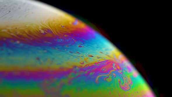 Psychedelic abstract planet from soap bubble. Macro Light refraction on a soap bubble alt