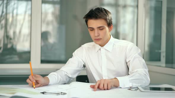 Attractive Engineer Architect Working in Office alt