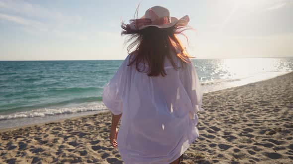 Slim Woman Walks Coast Sea in Sunset alt