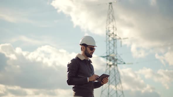 Electrical Engineer In Hard Hat.Foreman Developer Checking Construction.Architect In Hardhat Helmet alt