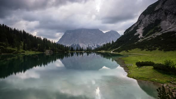 Time Lapse Symmetrical Reflection in Mountain Lake Tirol Austria alt