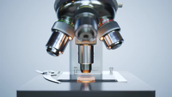 A modern microscope in a sterile laboratory room analyzing cell samples. 4KHD