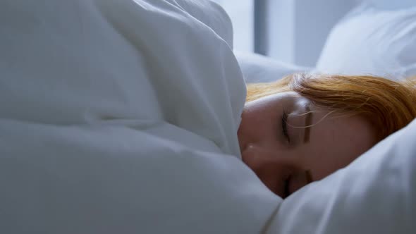 Woman sleeping in bedroom at home 4k alt