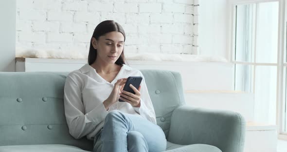 Overjoyed and Excited Female Laughing Celebrating Online Lottery Win alt