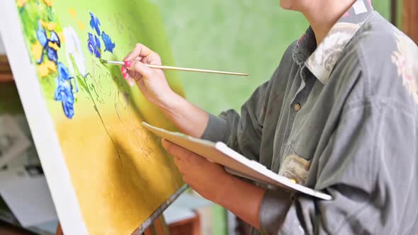 Female Artist Hand Holding Paint Brush and Drawing Oil Painting alt