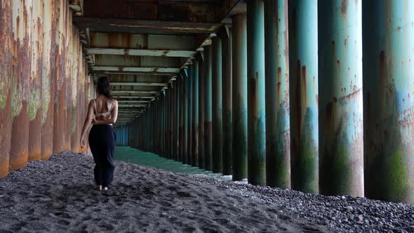 Sexy Lady is Dancing Near Sea Moving Under Pier Alone Freedom and Art Performance alt