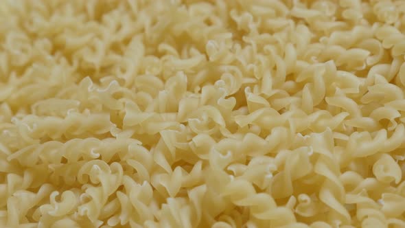 Spiral pasta  ready to be cooked close-up slow tilt 4K 2160p 30fps UltraHD footage - Girandole corks alt