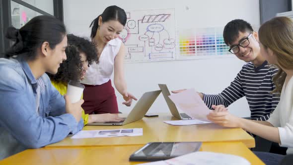 Group of asian young creative happy people entrepreneur on a business meeting office alt