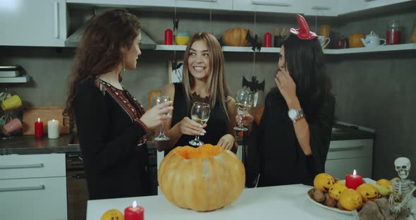 Three Masked Girls at Halloween Party Drinking alt