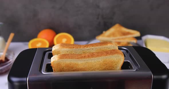 Slices of Toast Coming Out of the Toaster 
