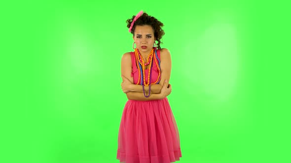 Beautiful Sweet Girl Froze and Trying To Keep Warm Against Green Screen alt