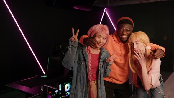 Multiracial Esports Team Taking a Photo Cyber Sport Concept Cowboy Shot alt