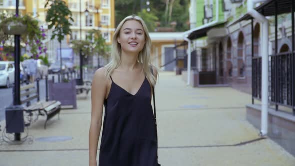 Beautiful Girl Walking the City Street alt