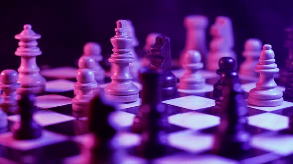 Board Intelligence Game  Wooden Chess Under Neon Colorful Light and Smoke alt