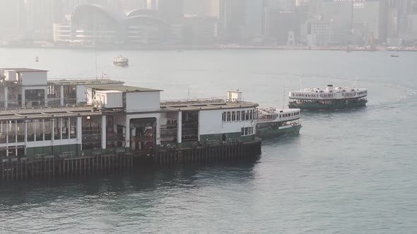 Star Ferry Boat Leaving And Arriving At The Tsim Sha Tsu Pier In Victoria Harbour Hong Kong, China.- alt