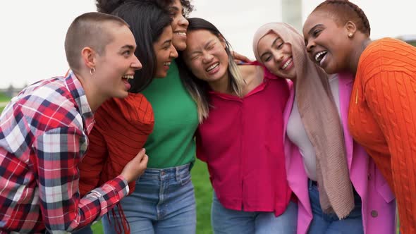 Happy multiracial women having fun together outdoor - Beautiful diverse female friends