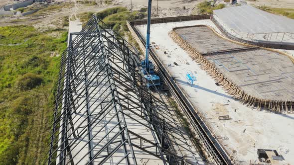 Aerial Flight View of the Metal Structure of the Roof of the House alt