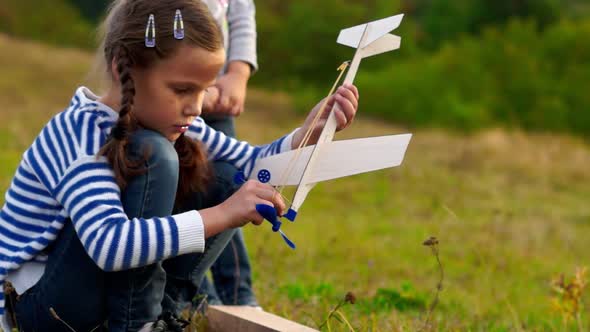 Girls Making Wooden Planes and Having a Fun Time.