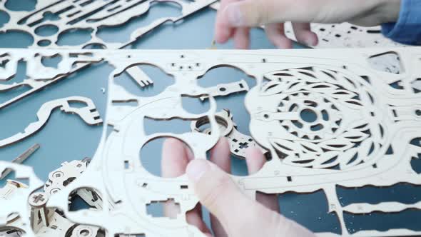 Mechanical wooden gear toy with small details and flywheels. alt