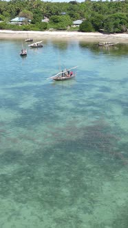 Boat Boats in the Ocean Near the Coast of Zanzibar Tanzania Slow Motion Vertical Video alt