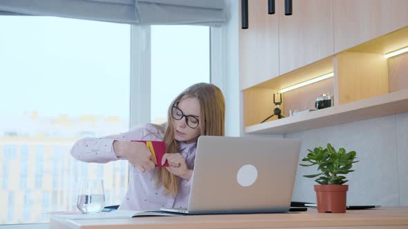 Young teacher teaches children the alphabet online, shows pictures with letters alt
