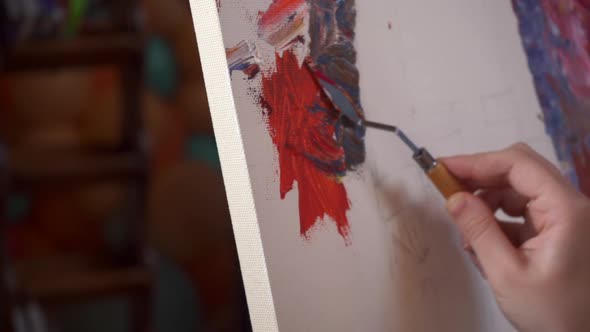 Artist Using a Palette Knife Paint Colorful Picture Close Up Shot