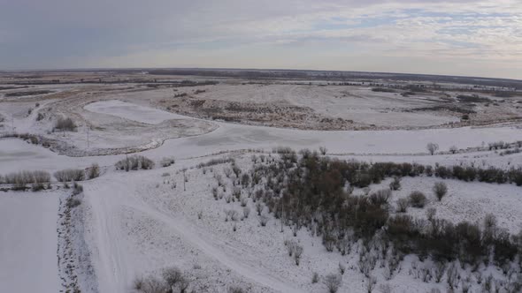 Aerial Footage of an Ice Covered River on a Winter Day