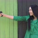 Pistol in hands of girl - VideoHive Item for Sale