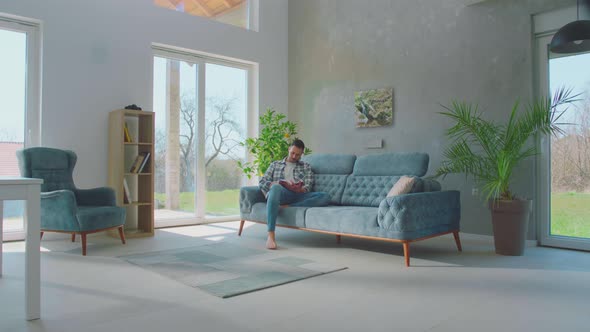 Married couple reading book together alt