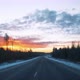 View Through the Windshield of a Moving Car on the Road in Winter and a Beautiful Sunrise in the Sky - VideoHive Item for Sale