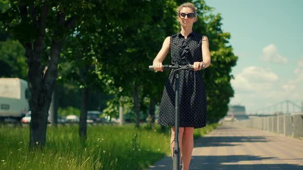Woman Ride On Electric Scooter Mobility. Urban Riding Ecological Transport Travel. alt
