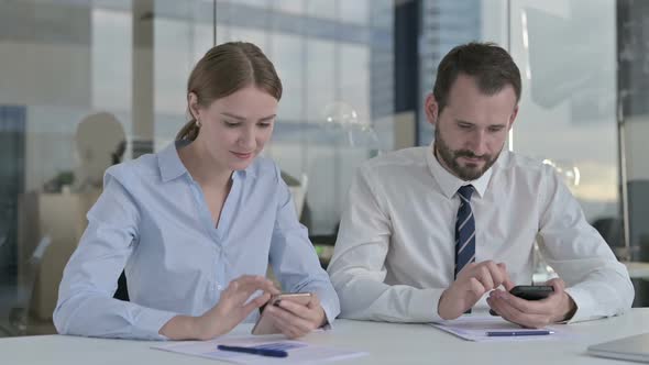 Executive Business People Using Cellphone on Board Room Desk alt
