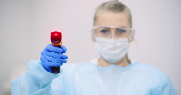 Doctor Measuring Patient Temperature at Health Care Clinic alt
